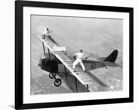 Daredevils Playing Tennis on a Biplane-null-Framed Photographic Print