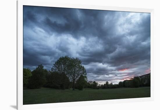 Dark clouds above a park-Benjamin Engler-Framed Photographic Print