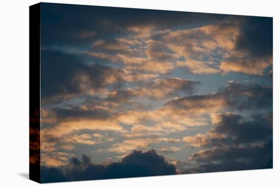 Dark Clouds over a Hilly Landscape at Sunset-Clive Nolan-Stretched Canvas