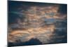 Dark Clouds over a Hilly Landscape at Sunset-Clive Nolan-Mounted Photographic Print