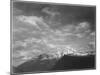 Dark Foreground And Clouds Mountains Highlighted "Heaven's Peak" Glacier NP Montana. 1933-1942-Ansel Adams-Mounted Art Print