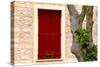 Dark red shutters in the wall of a house in France.-Tom Haseltine-Stretched Canvas