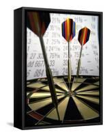 Darts on a Dartboard with Stock Figures in the Background-null-Framed Stretched Canvas