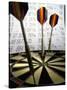 Darts on a Dartboard with Stock Figures in the Background-null-Stretched Canvas