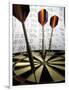 Darts on a Dartboard with Stock Figures in the Background-null-Framed Photographic Print