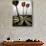 Darts on a Dartboard with Stock Figures in the Background-null-Photographic Print displayed on a wall