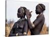 Dassanech Girl Braids Her Sister's Hair at Her Village in the Omo Delta-John Warburton-lee-Stretched Canvas