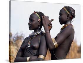Dassanech Girl Braids Her Sister's Hair at Her Village in the Omo Delta-John Warburton-lee-Stretched Canvas