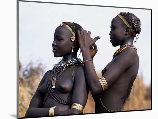 Dassanech Girl Braids Her Sister's Hair at Her Village in the Omo Delta-John Warburton-lee-Mounted Photographic Print