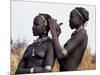 Dassanech Girl Braids Her Sister's Hair at Her Village in the Omo Delta-John Warburton-lee-Mounted Photographic Print