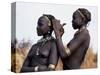 Dassanech Girl Braids Her Sister's Hair at Her Village in the Omo Delta-John Warburton-lee-Stretched Canvas