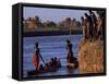 Dassanech Tribesmen and Women Load into a Dugout Canoe Ready to Pole across the Omo River, Ethiopia-John Warburton-lee-Framed Stretched Canvas