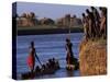 Dassanech Tribesmen and Women Load into a Dugout Canoe Ready to Pole across the Omo River, Ethiopia-John Warburton-lee-Stretched Canvas