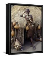 Datoga Woman Relaxes Outside Her Thatched House, Tanzania-Nigel Pavitt-Framed Stretched Canvas