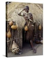 Datoga Woman Relaxes Outside Her Thatched House, Tanzania-Nigel Pavitt-Stretched Canvas