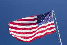 Giant US flag flying beneath a deep blue sky above Truman Avenue, Old Town-David Tomlinson-Photographic Print