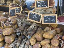 Selection of Corsican sausages and hams for sale at open-air market in Place Foch, Ajaccio-David Tomlinson-Framed Photographic Print