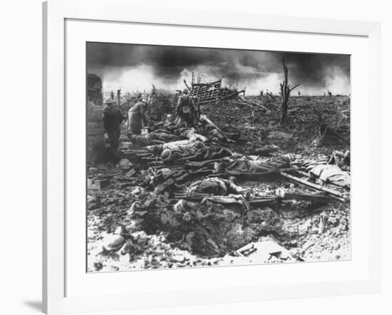 Dawn Rising on Muddy, Horrific Battlefield of Passchendaele as Soldiers Tend to the Dead During WWI-null-Framed Photographic Print