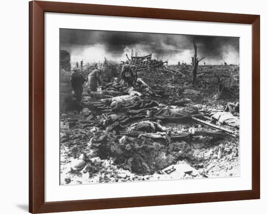 Dawn Rising on Muddy, Horrific Battlefield of Passchendaele as Soldiers Tend to the Dead During WWI-null-Framed Photographic Print