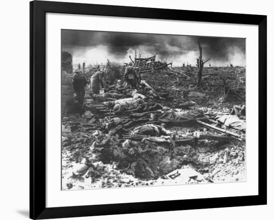 Dawn Rising on Muddy, Horrific Battlefield of Passchendaele as Soldiers Tend to the Dead During WWI-null-Framed Photographic Print