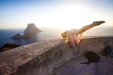 A Young Woman Does an Acrobatic Yoga Pose at the Torre Des Savinar Lookout Tower in Sw Ibiza-Day's Edge Productions-Photographic Print