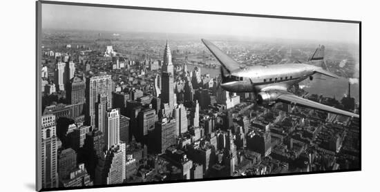 DC-4 over Manhattan, NYC-null-Mounted Art Print