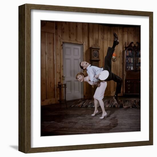 Debbie Reynolds Lifts Fellow Actor Tony Randall in a Scene from 'The Mating Game', 1959-Allan Grant-Framed Photographic Print