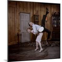 Debbie Reynolds Lifts Fellow Actor Tony Randall in a Scene from 'The Mating Game', 1959-Allan Grant-Mounted Photographic Print