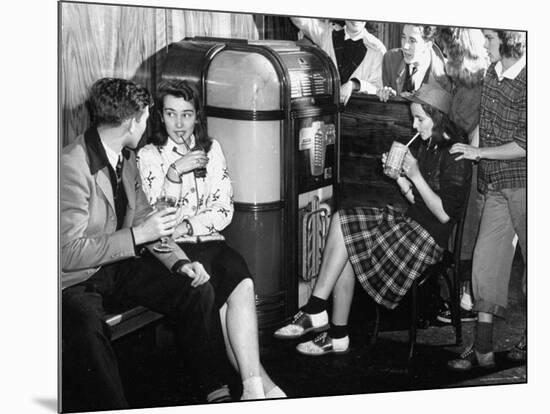 Debutantes with Dates at Local Malt Shop, Drinking Milkshakes-William C^ Shrout-Mounted Photographic Print