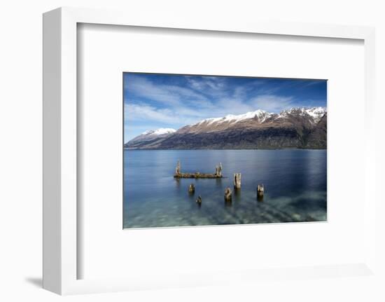 Decayed jetty, old wooden posts in Lake Wakatipu at Glenorchy, New Zealand-Ed Rhodes-Framed Photographic Print