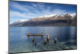 Decayed jetty, old wooden posts in Lake Wakatipu at Glenorchy, New Zealand-Ed Rhodes-Mounted Photographic Print