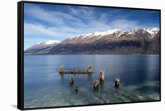 Decayed jetty, old wooden posts in Lake Wakatipu at Glenorchy, New Zealand-Ed Rhodes-Framed Stretched Canvas