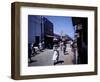 December 1946: Passersby at Market Street in Montego Bay, Jamaica-Eliot Elisofon-Framed Photographic Print