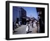 December 1946: Passersby at Market Street in Montego Bay, Jamaica-Eliot Elisofon-Framed Photographic Print