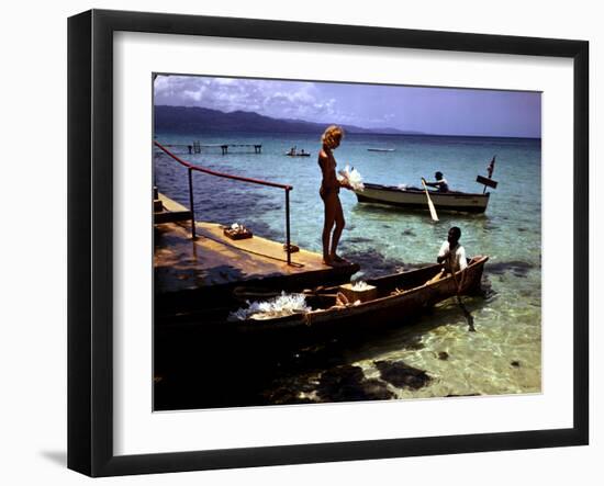 December 1946: Woman and Fishermen at Doctor's Cave Beach in Montego Bay, Jamaica-Eliot Elisofon-Framed Photographic Print