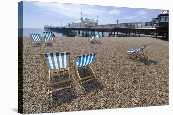 Deck chairs on the pebble beach in Brighton-Natalie Tepper-Stretched Canvas