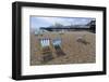 Deck chairs on the pebble beach in Brighton-Natalie Tepper-Framed Photo