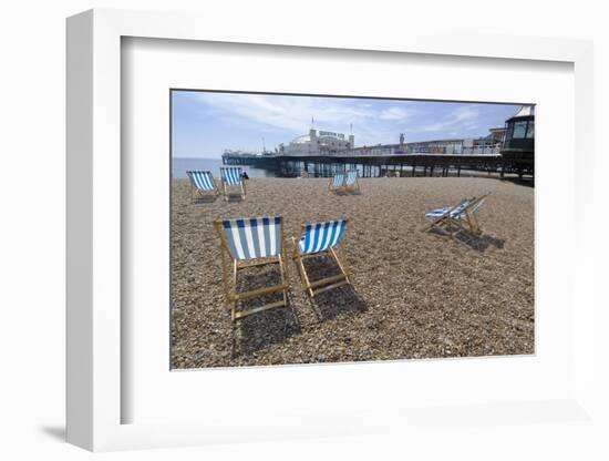 Deck chairs on the pebble beach in Brighton-Natalie Tepper-Framed Photo