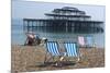 Deckchairs on the Pebble Beach Seafront with the Ruins of West Pier Brighton England-Natalie Tepper-Mounted Photo