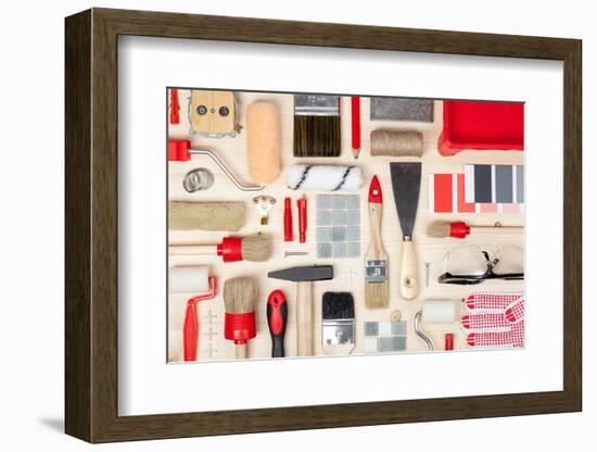 Decorating and House Renovation Tools and Accessories on Wooden Background Top View. Painter and De-123object-Framed Photographic Print