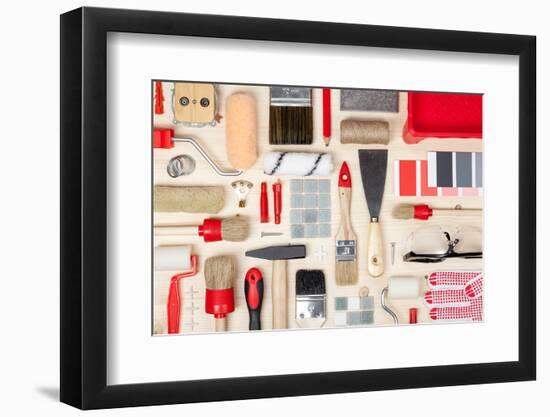 Decorating and House Renovation Tools and Accessories on Wooden Background Top View. Painter and De-123object-Framed Photographic Print