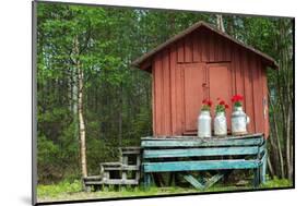 Decoration with Milk Canisters in Front of Small Barn in Finnish Lapland.-Claudine Van Massenhove-Mounted Photographic Print