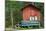 Decoration with Milk Canisters in Front of Small Barn in Finnish Lapland.-Claudine Van Massenhove-Mounted Photographic Print