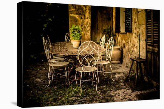 Decorative Table and Chairs on Patio in France-Will Wilkinson-Stretched Canvas