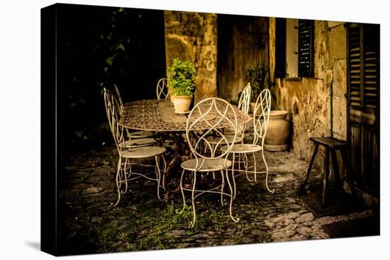Decorative Table and Chairs on Patio in France-Will Wilkinson-Stretched Canvas