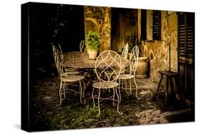 Decorative Table and Chairs on Patio in France-Will Wilkinson-Stretched Canvas