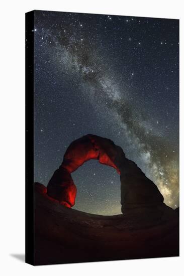 Delicate Arch and the Milky Way.-Jon Hicks-Stretched Canvas