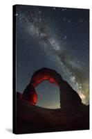 Delicate Arch and the Milky Way.-Jon Hicks-Stretched Canvas