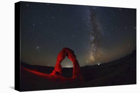 Delicate Arch and the Milky Way.-Jon Hicks-Stretched Canvas