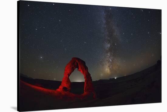 Delicate Arch and the Milky Way.-Jon Hicks-Stretched Canvas